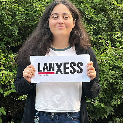 Amna with LanXESS sign