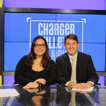Two students in Communication studio